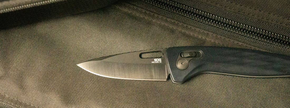 SOG folding knife on a pack